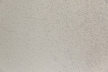 White concrete wall with jagged texture 