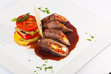 meat rolls with sauce and vegetables cheese