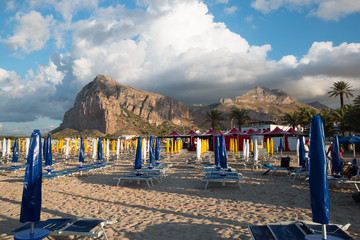 Beach with umbrellas in San Vito Lo Capo, Italy.