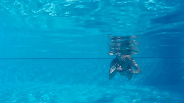 woman swimming in the pool