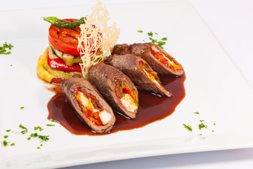 meat rolls with sauce and vegetables cheese