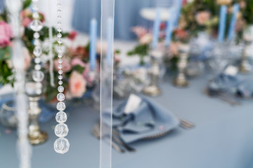 A view through crystal chain and transparent ribbon on a dinner