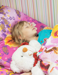 Beautiful little girl with a toy polar bear.