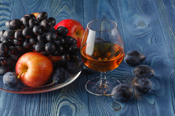 Fruit on her cover look interesting. Cognac served with fruit.