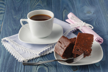 Chocolate brownies on a dark wooden background