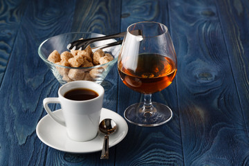 Close up a glass of cognac and coffee