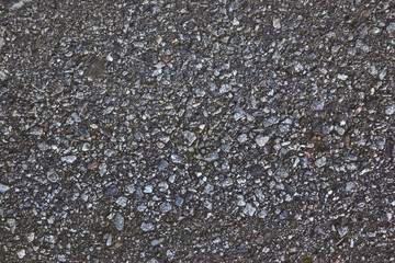 Asphalt road of black and grey stones