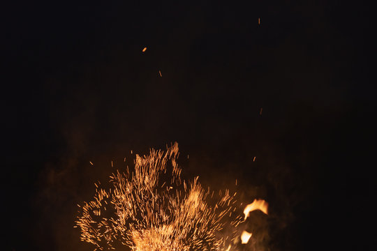firecamp sparks over night sky