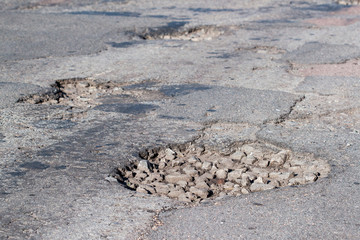 Large pit on the road.