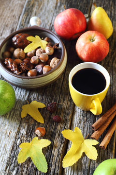 Autumn composition: nuts, fruit and cup of coffee
