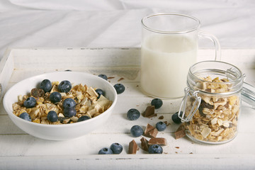 breakfast with cereals, blueberries, chocolate and milk 06534