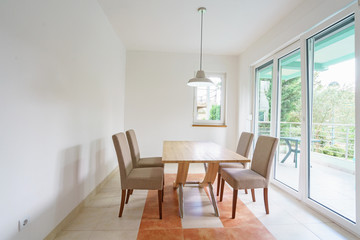 Interior of a guest house room with dining zone