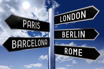 Obraz premium Signpost with 5 arrows - capital cities (London, Paris, Berlin, Barcelona, Rome) - great for topics like traveling, sightseeing etc.