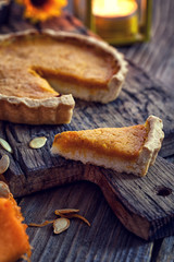 Thanksgiving pumpkin pie  on wooden background