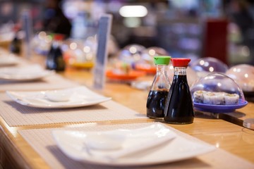 Sauces and sushi on table