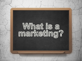 Marketing concept: What is a Marketing? on chalkboard background