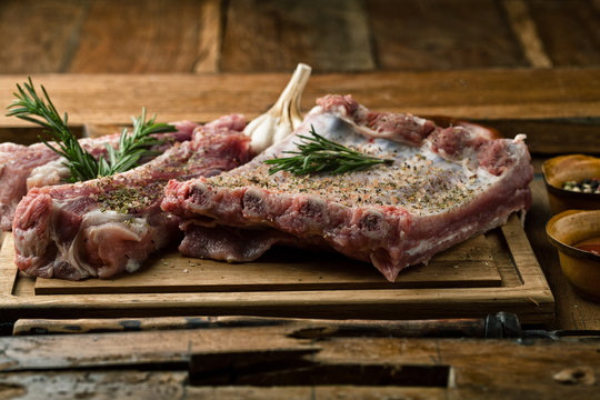 Raw pork ribs with spices and rosemary