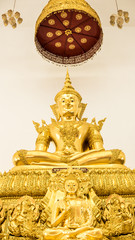 Detail of Buddha gold statues decorating the Buddhist temple  in Wat Hin Thaen Lamphachi temple (Temple public) . Kanchanaburi ,Thailand