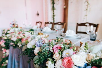 tables decor in the restaurant at wedding ceremony, flowers, food and number table