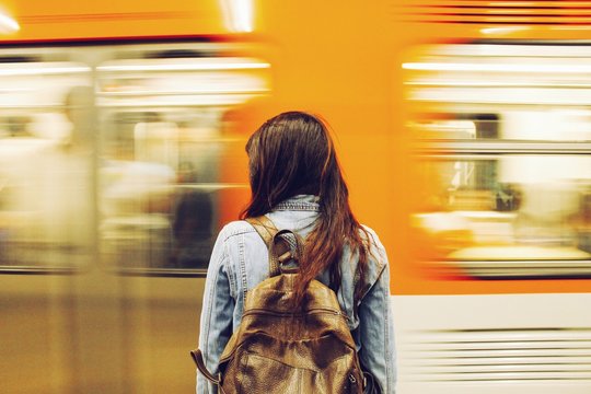 Woman Against Speeding Blurred Train