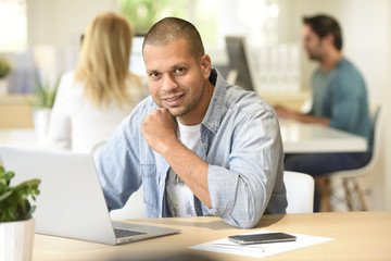 Man in office working on laptop computer