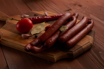 sausage and spices on a wooden tablet or laptop