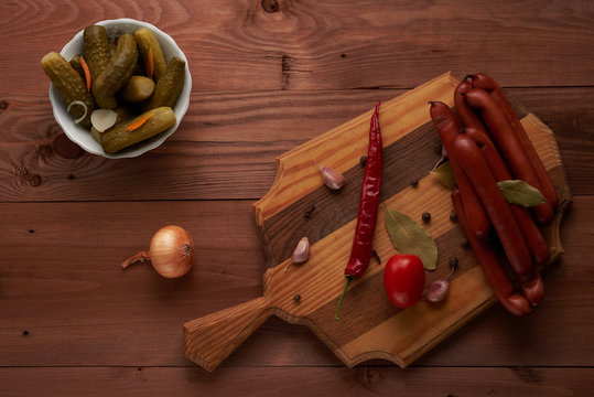 small sausages and pickles on the table