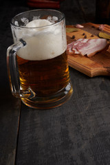 bacon and glass of beer on a table