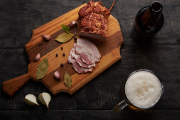 bacon and glass of beer on a table