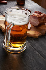 bacon and glass of beer on a table