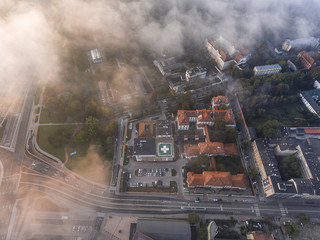 Aerial view of hospital with clouds from sky. Photo like maps of medical center