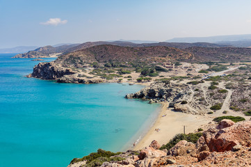 Sandy beach and clear blue water at lagoon of Crete island near Sitia town