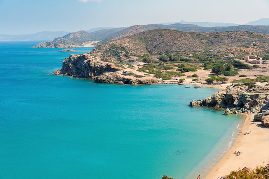 Sandy beach and lagoon with clear blue water at Crete island near Sitia town
