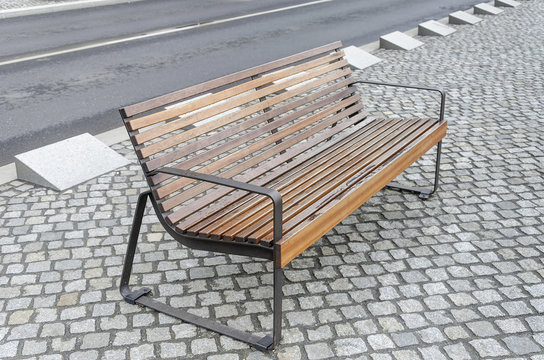 Modern Bench On The Pavement.