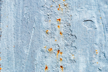 A background of peeling paint and rusty old metal