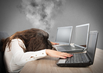 Stressed businesswoman due to overwork