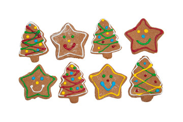 Delightful Christmas tree and star shaped colorful gingerbread cookies on white