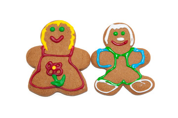 Colorful gingerbred man and woman on white background