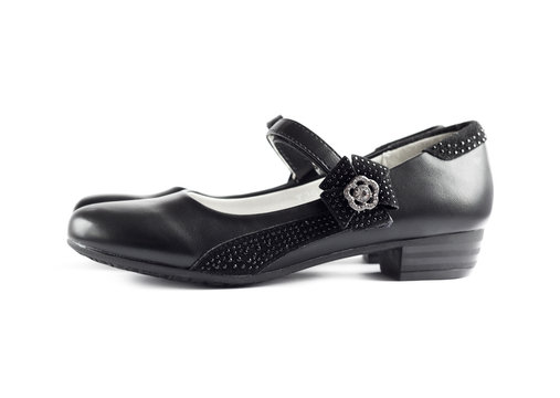 Pair of black shoes for girl on white background