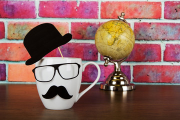 Coffee cup with a black hipster mustache