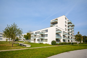 New apartment building - modern residential development in a green urban settlement