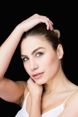 Obraz premium Portrait of beautiful woman posing against black background