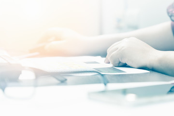 Young businesswoman working at her desk in office, selective focus