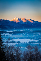 Sunrise in Zakopane with illuminated mountain by sun in winter, Tatra Mountains, Poland