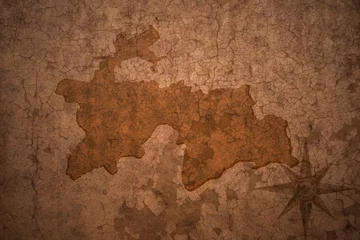 Afwasbaar Fotobehang Verweerde muur Tadzjikistan kaart op vintage crack papier achtergrond