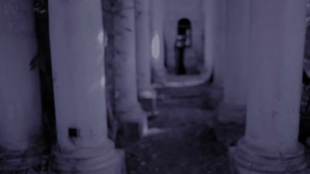 ghost nun. devilish woman in nun costume walking around the temple. halloween