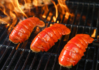 Lobster tails cooking on grill