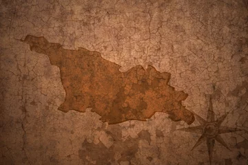 Wall murals Old dirty textured wall georgia map on vintage crack paper background