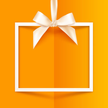 White vector gift box frame with silky bow and ribbon on orange folded paper background