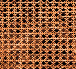 Texture of orange lacquered wicker wood